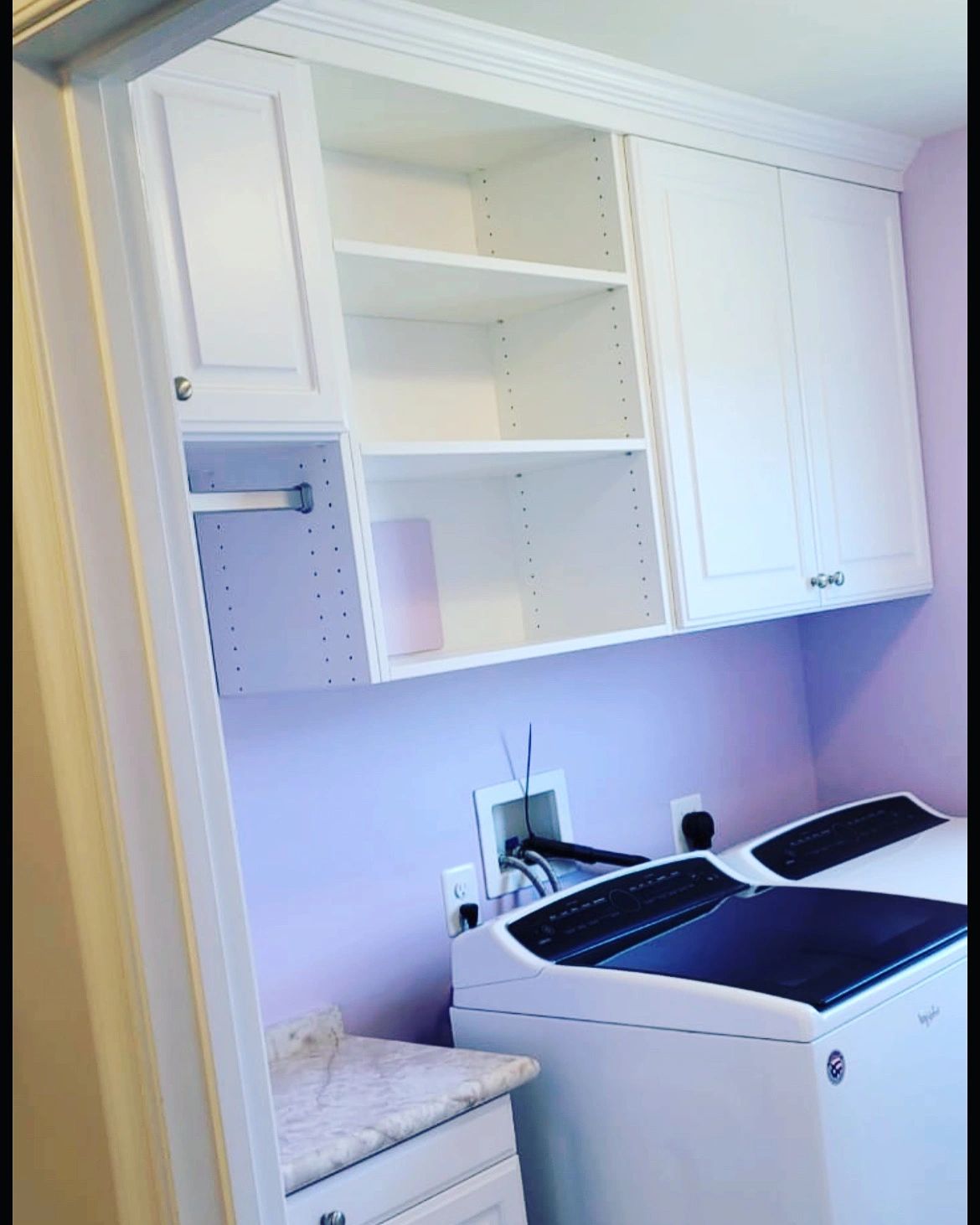 Custom laundry room storage white cabinets Fantasy Closets Northern Virginia