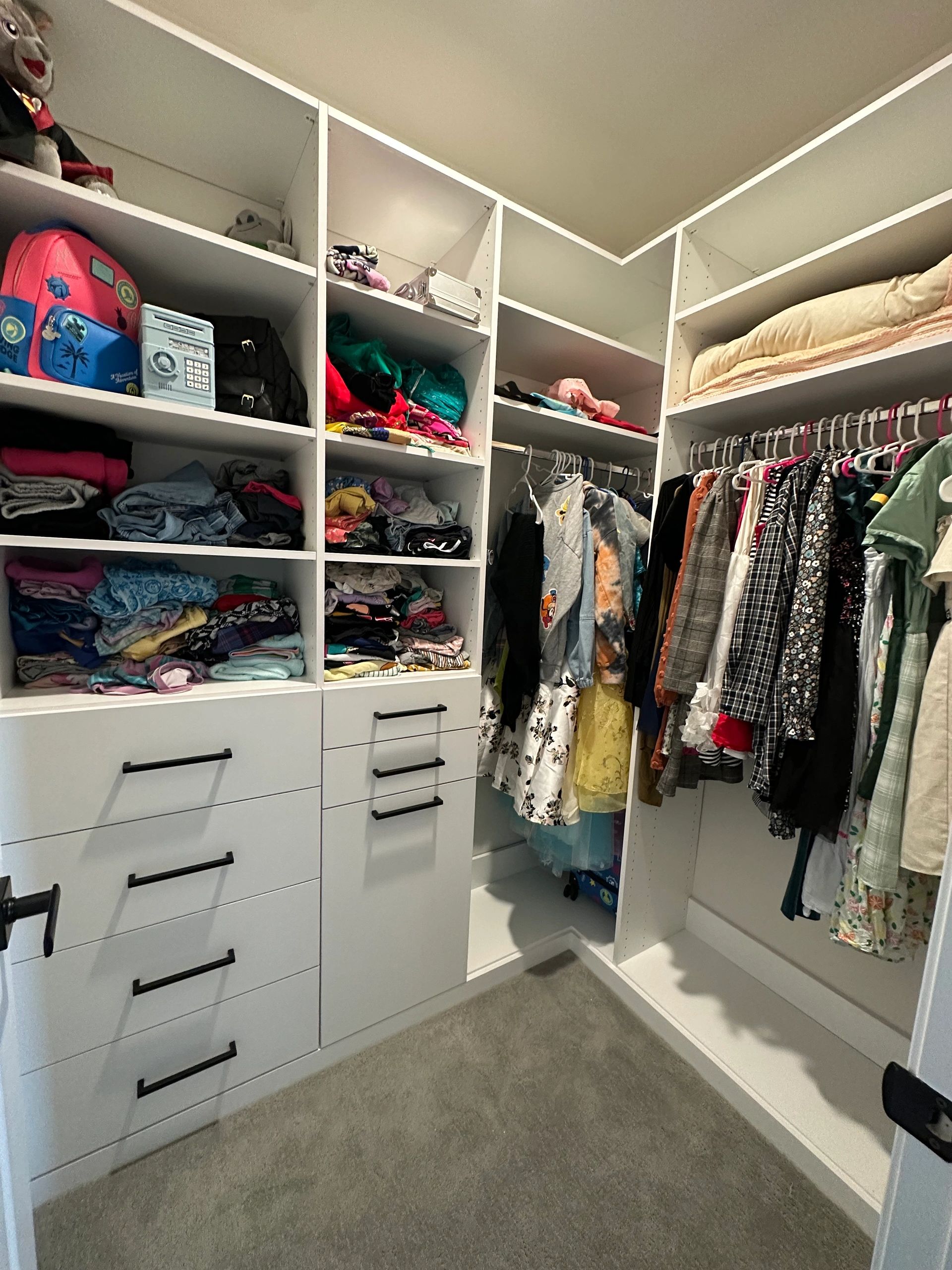Walk-in closet white finish adjustable shelving Fantasy Closets