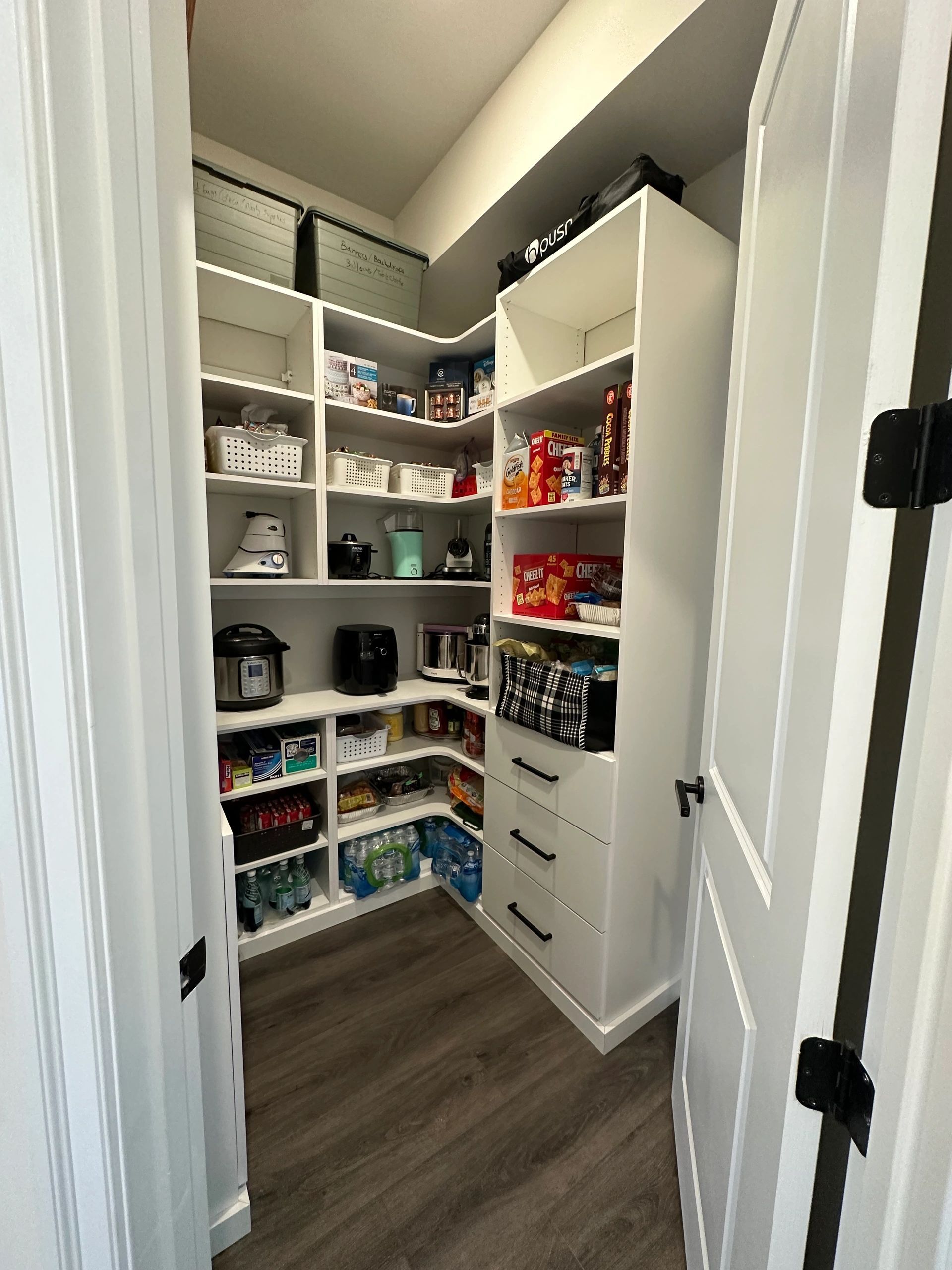 Custom pantry organized shelving white cabinetry Fantasy Closets