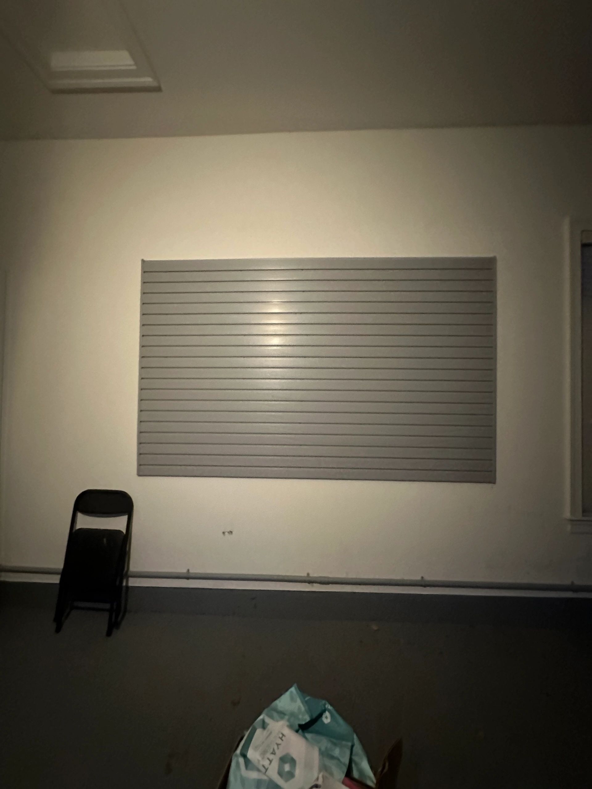 Garage storage floor-to-ceiling white cabinets Fantasy Closets