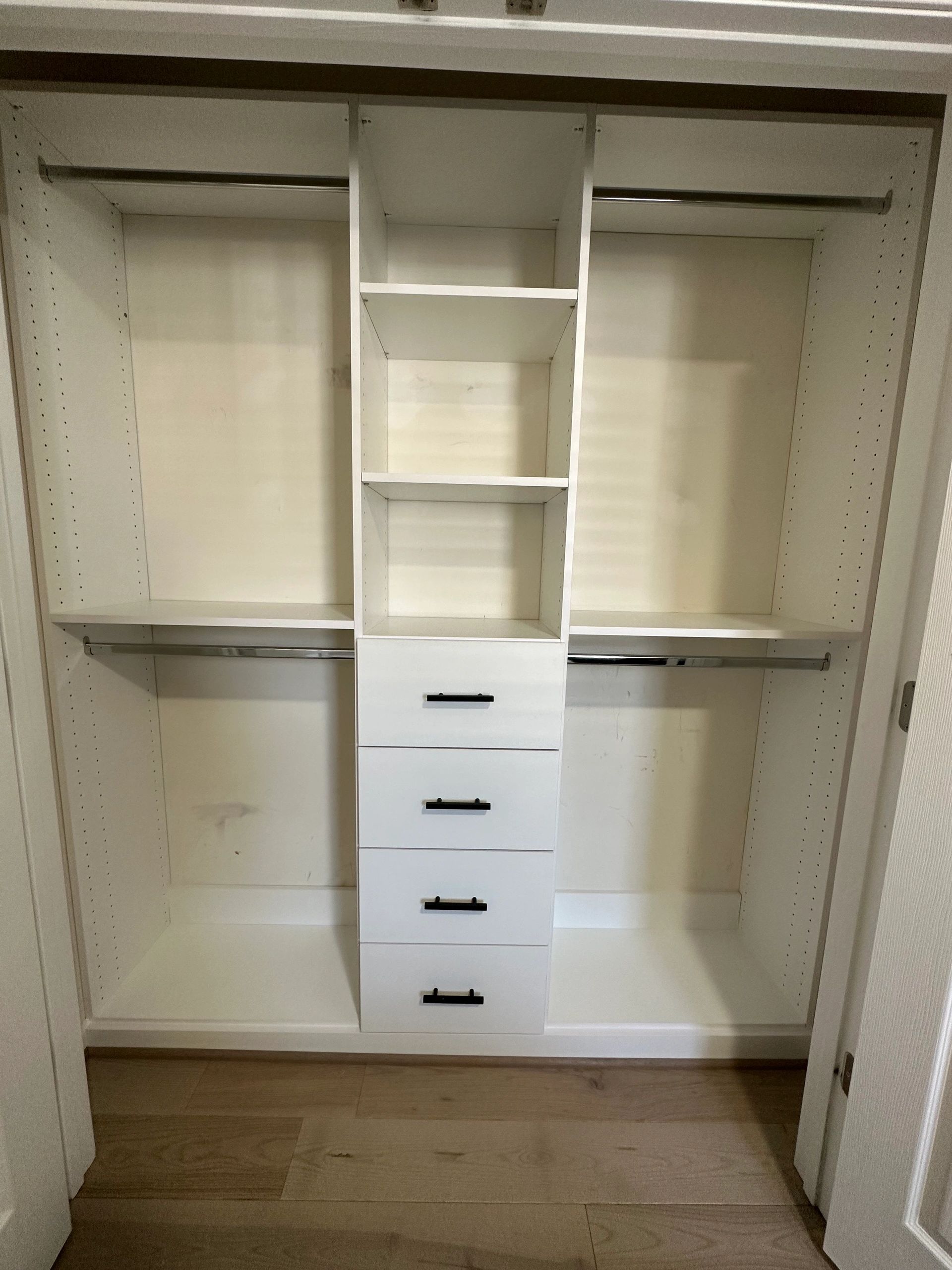 Custom reach-in closet white finish chrome hardware Fantasy Closets