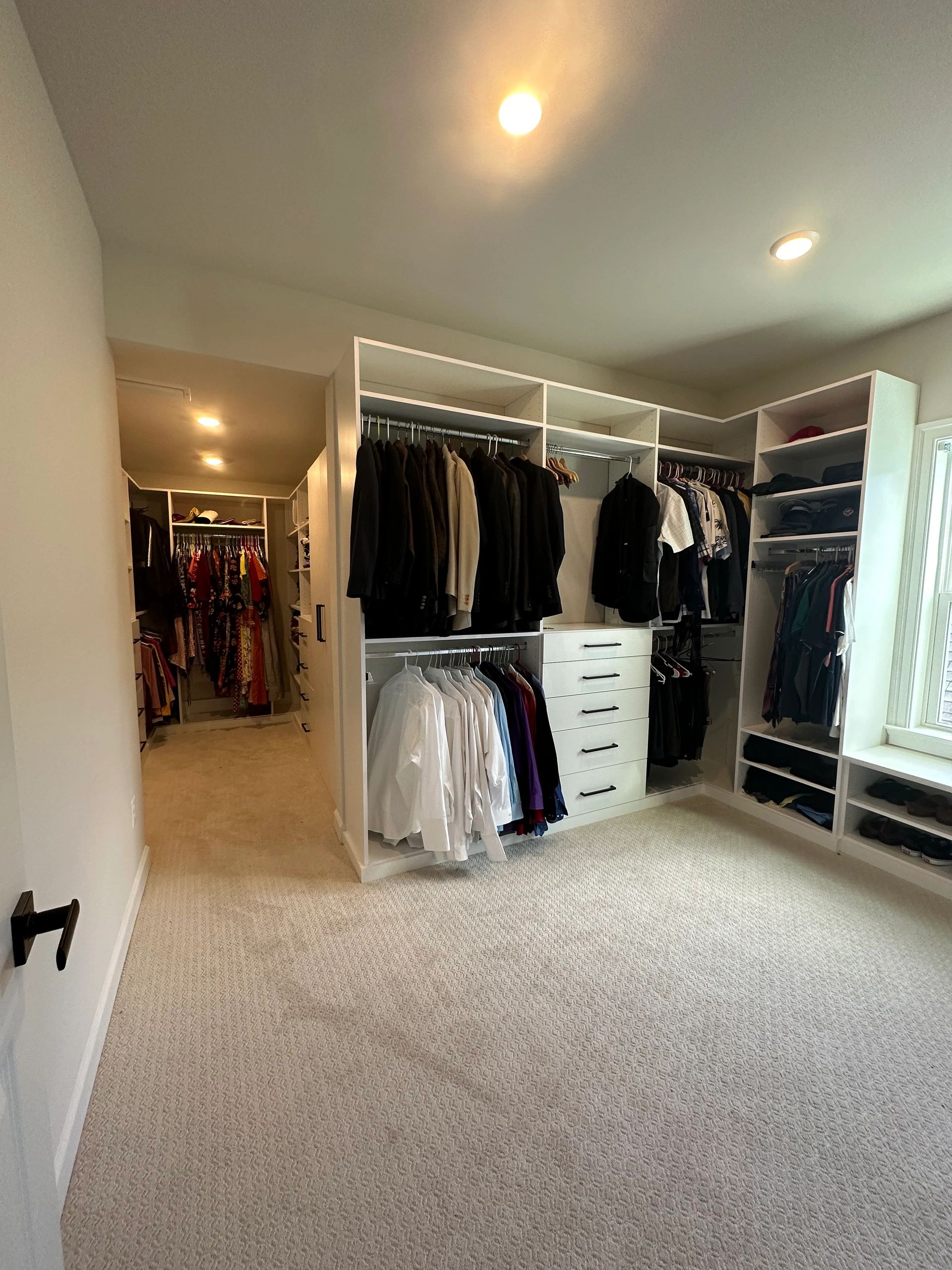 Custom walk-in wardrobe white cabinets chrome hardware Fantasy Closets