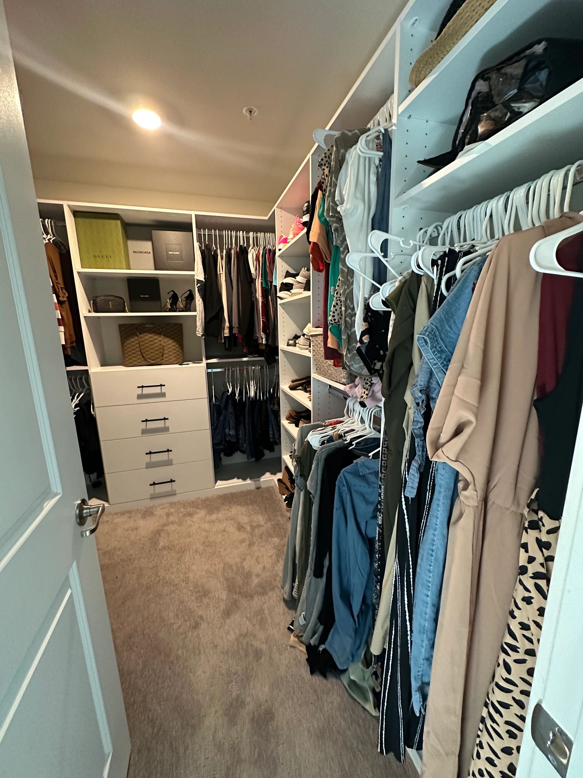 Walk-in closet custom shelving hanging rods Fantasy Closets