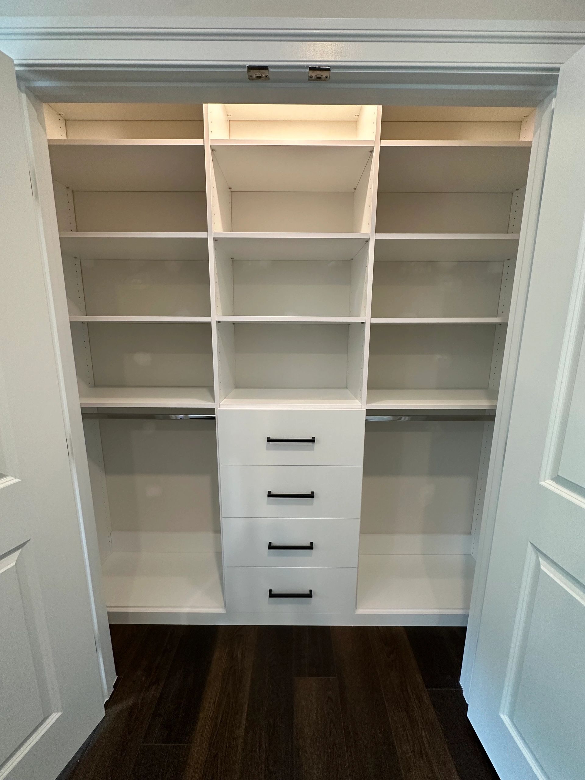 White reach-in closet adjustable shelving