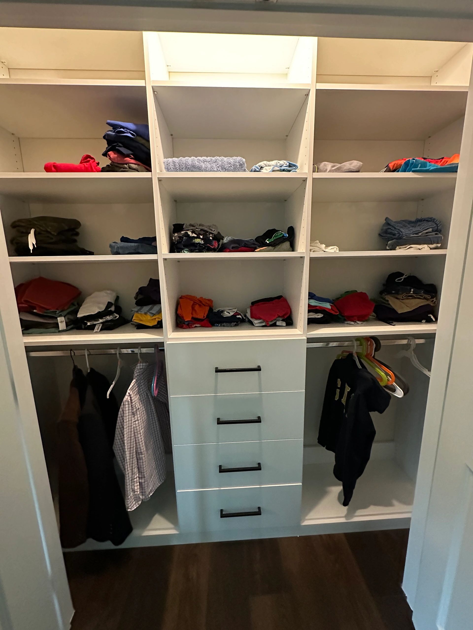 Custom reach-in closet drawers hanging space